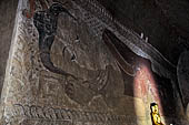 Bagan Myanmar. Sulamani temple. Large painted reclining Buddha. 